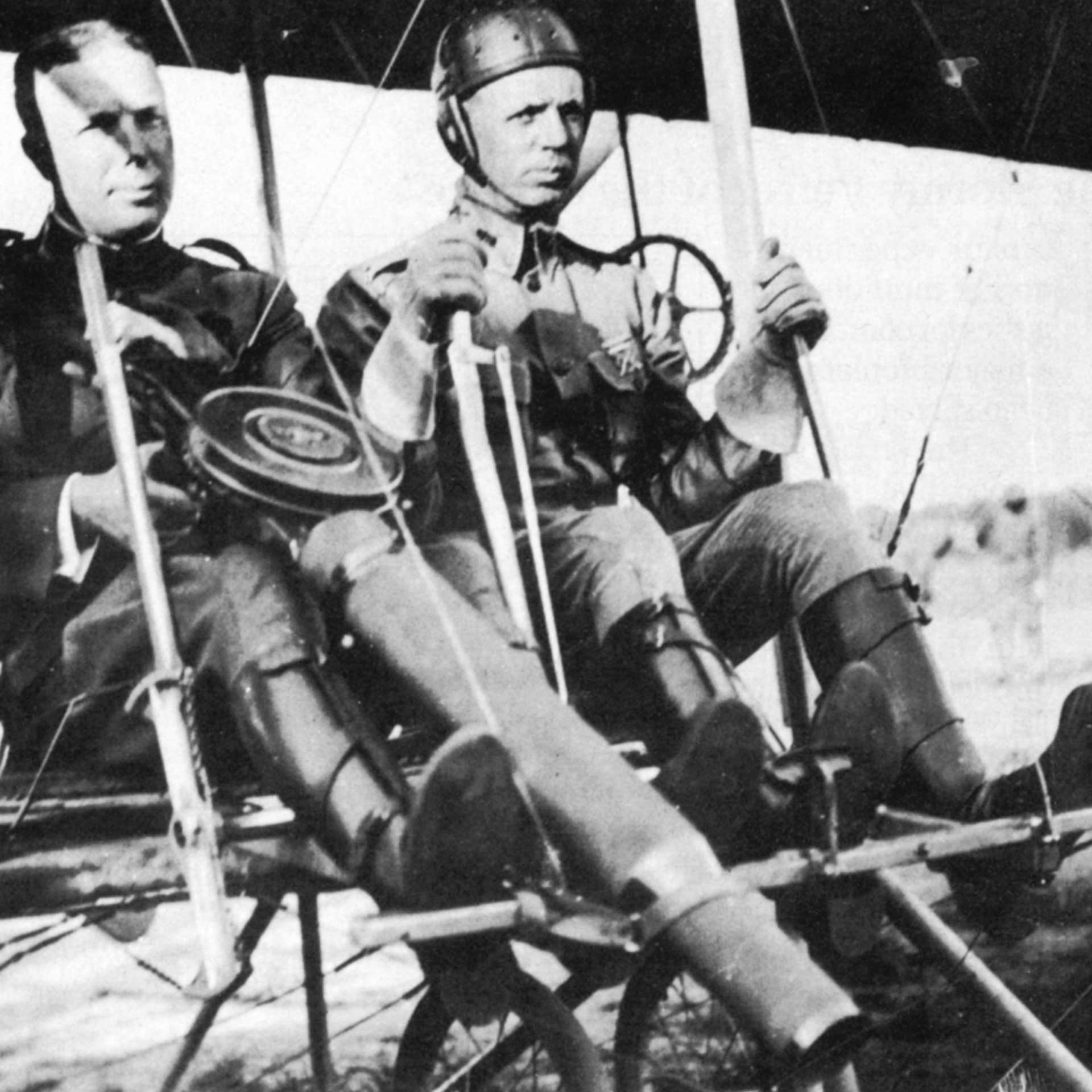 wright brothers two men airplane outdoors