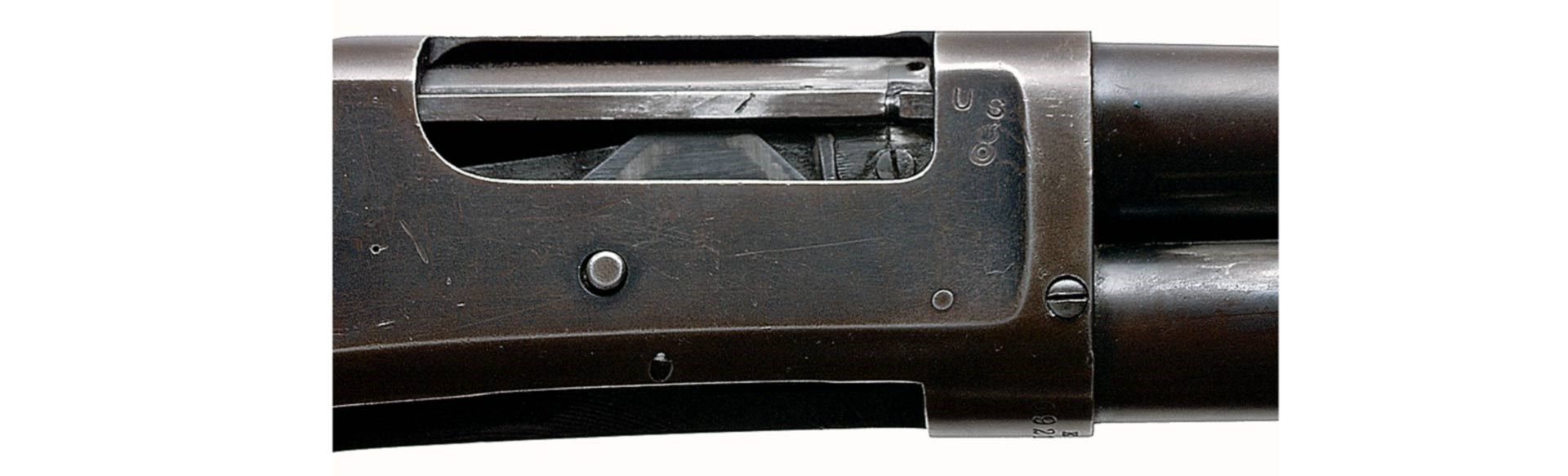 closeup shotgun receiver metal finish coloring