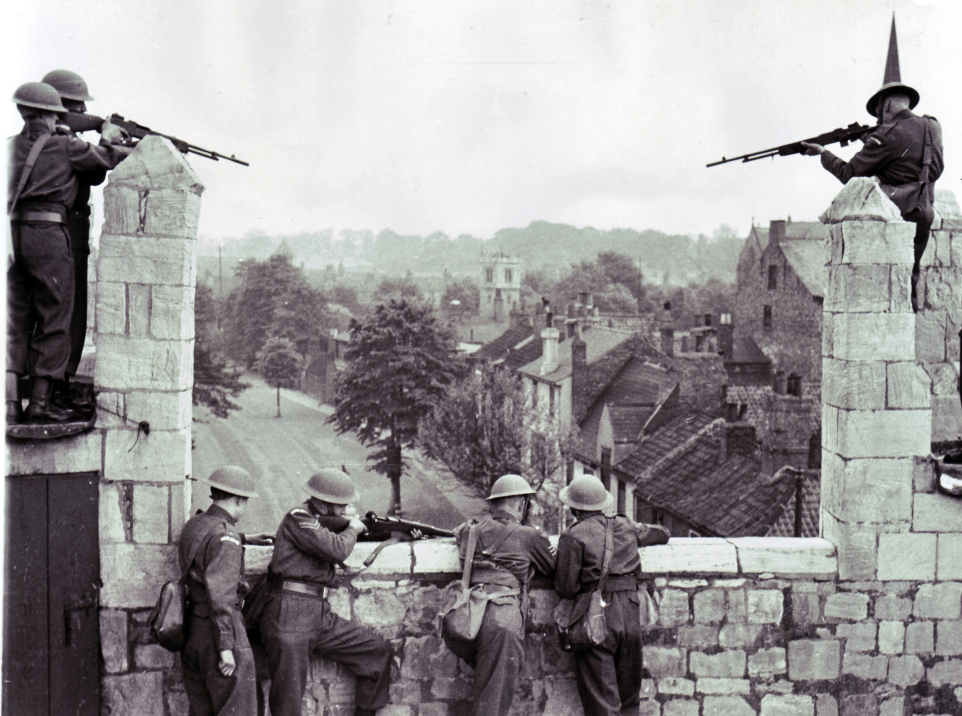 Home Guard men practice with U.S. .30-cal. weapons—M1917 and Browning Automatic Rifles.  NARA