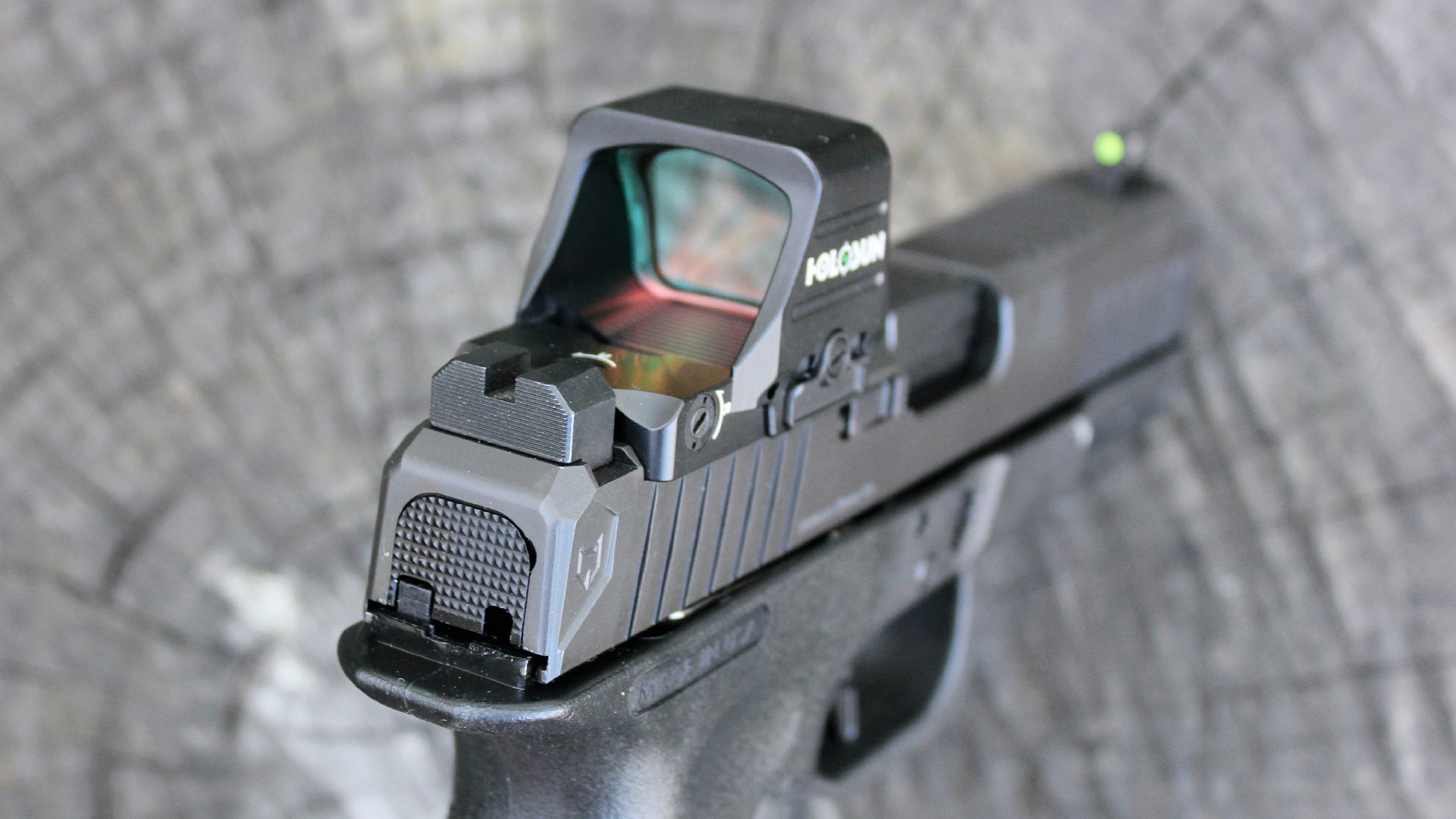 Lone Wolf Timberwolf 19x pistol rear view of slide and red-dot holosun optic attached raised square-notch rear sight at rear of gray slide