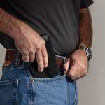 pistol being pulled out of front jeans pocket