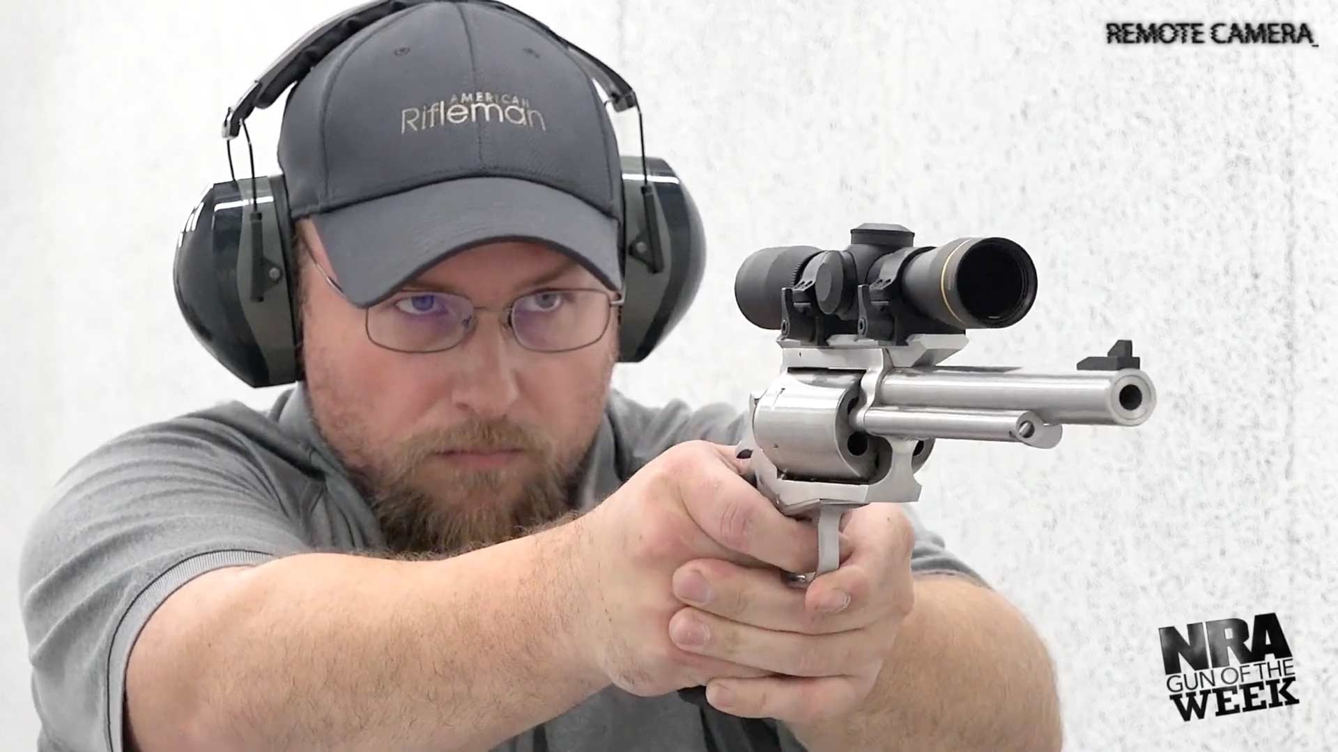Man on shooting range with Magnum Research Big Frame Revolver BFR stainless steel leupold scope