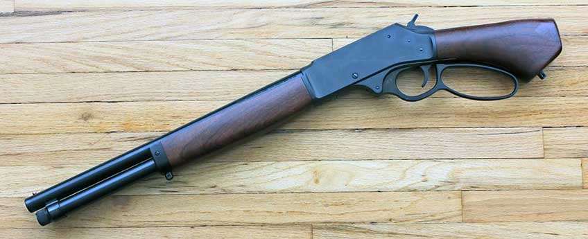 Henry repeating arms axe 410 bore gun on wood floor