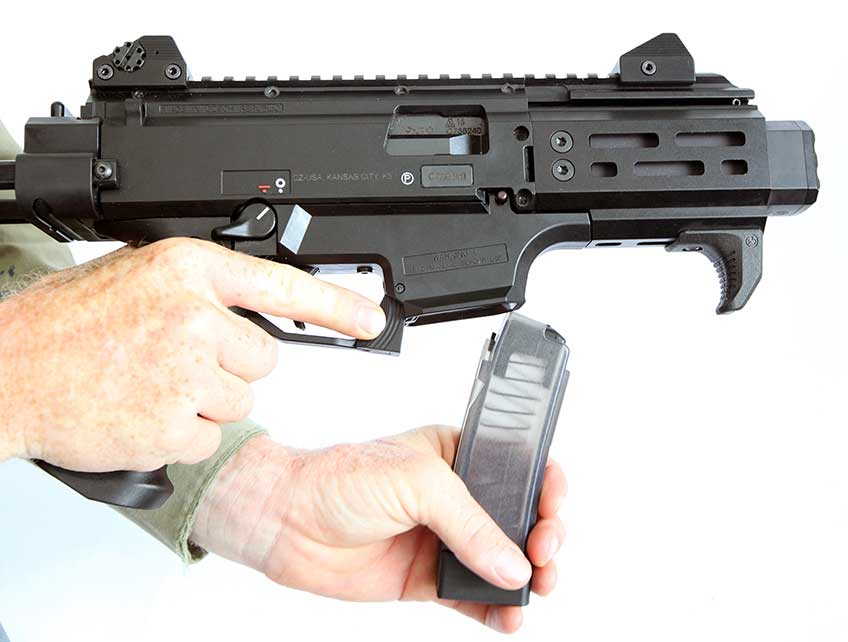 The magazine release can also be actuated by the index finger of the shooting hand. Scorpion magazines drop free when the release is actuated.