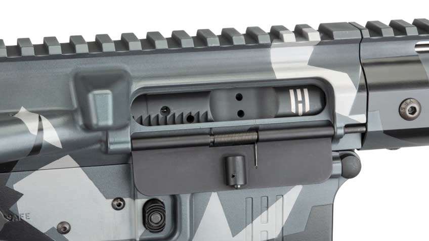 close-up rifle receiver action black gray metal aluminum white