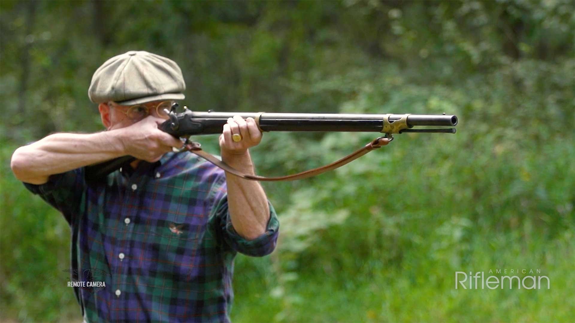 Man shooting a Model 1841 Mississippi rifle on an outdoor range.