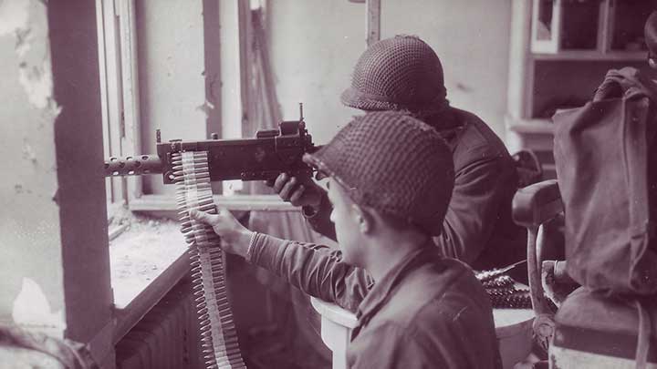 Men of the 104th Infantry Division fighting house-to-house in Cologne using a Browning M1919A6 machine gun.