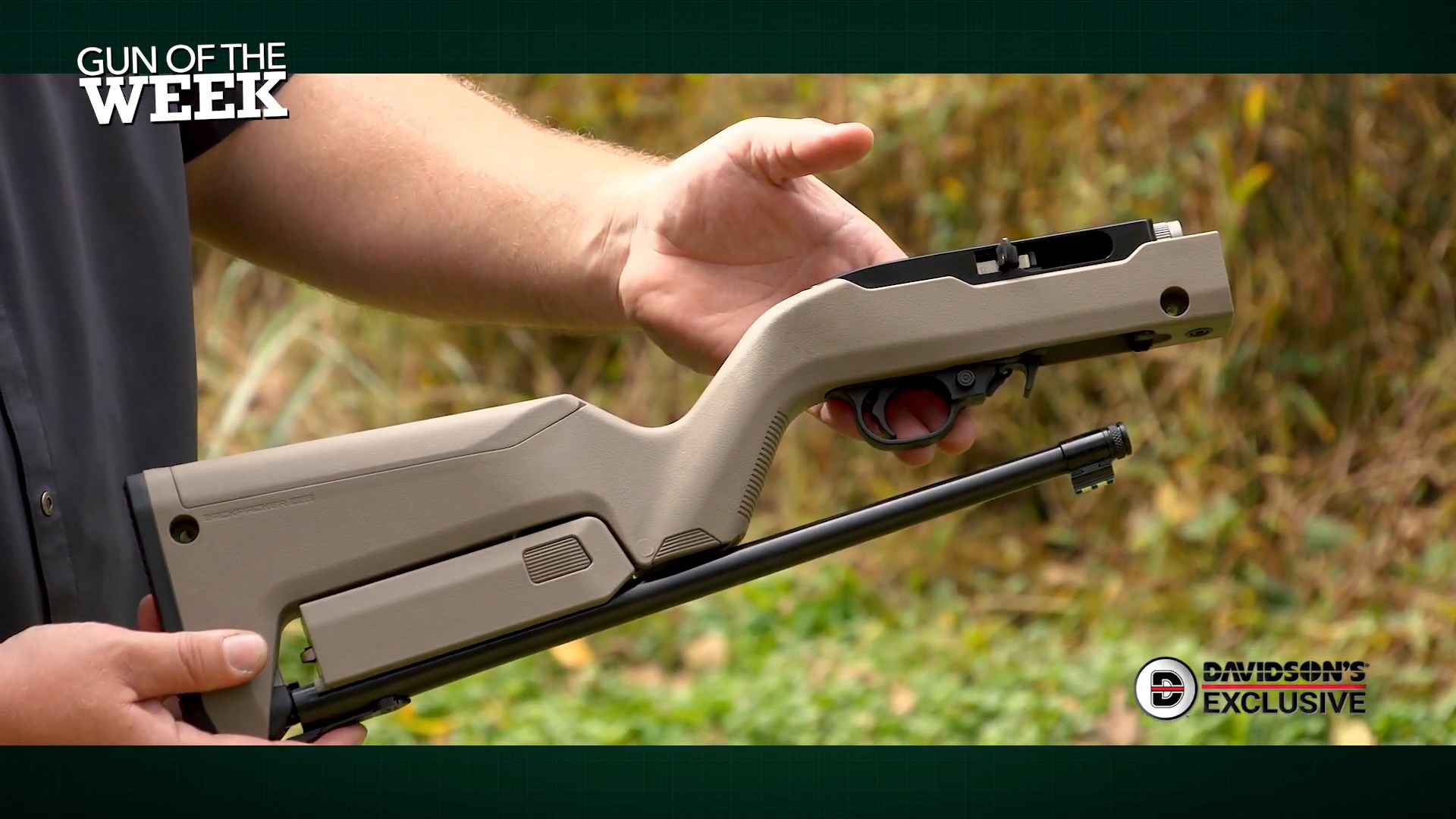 Ruger 10/22 Takedown FDE Davidson's Exclusive carbine rimfire folded compact in hands outdoors