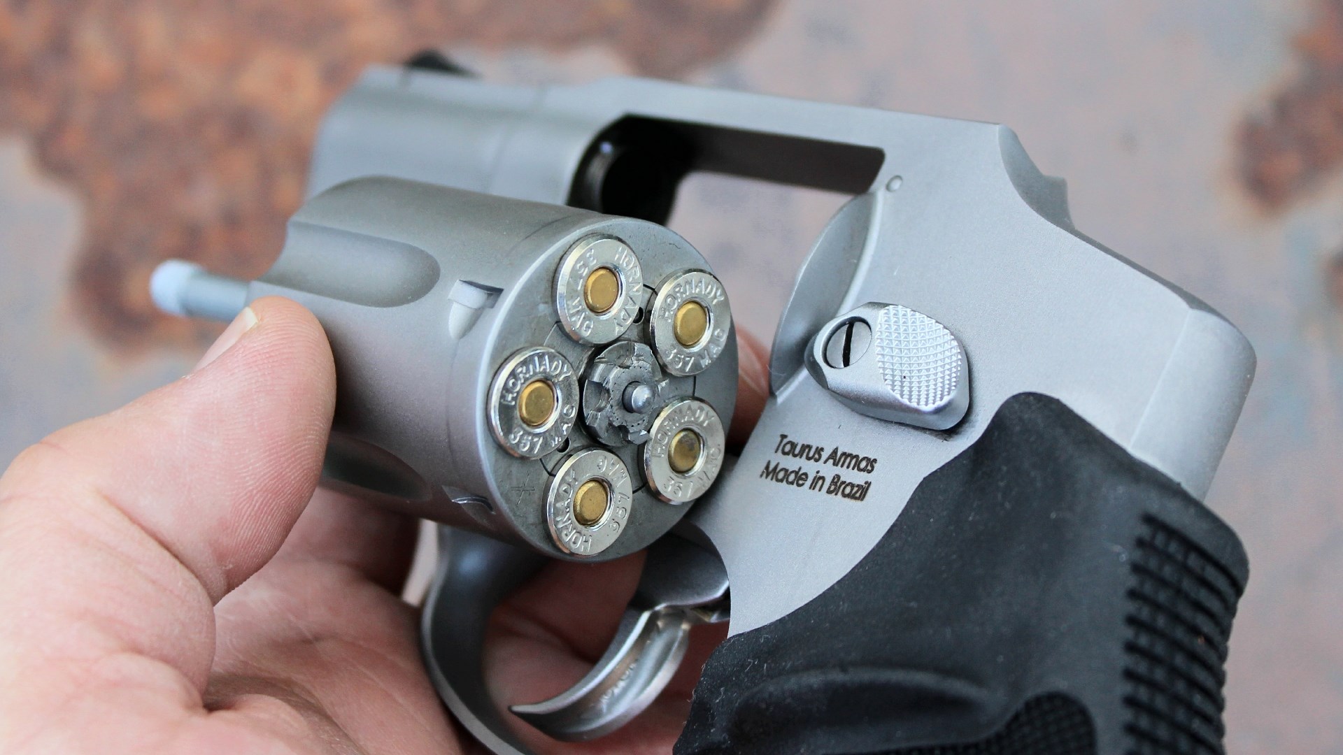 Rear view of the swung-out, five-round cylinder loaded with ammunition on the Taurus 605.