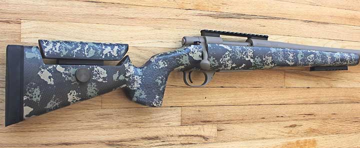The McMillian Adjustable Game Warden stock with Woodland Carbon Ambush camouflage.
