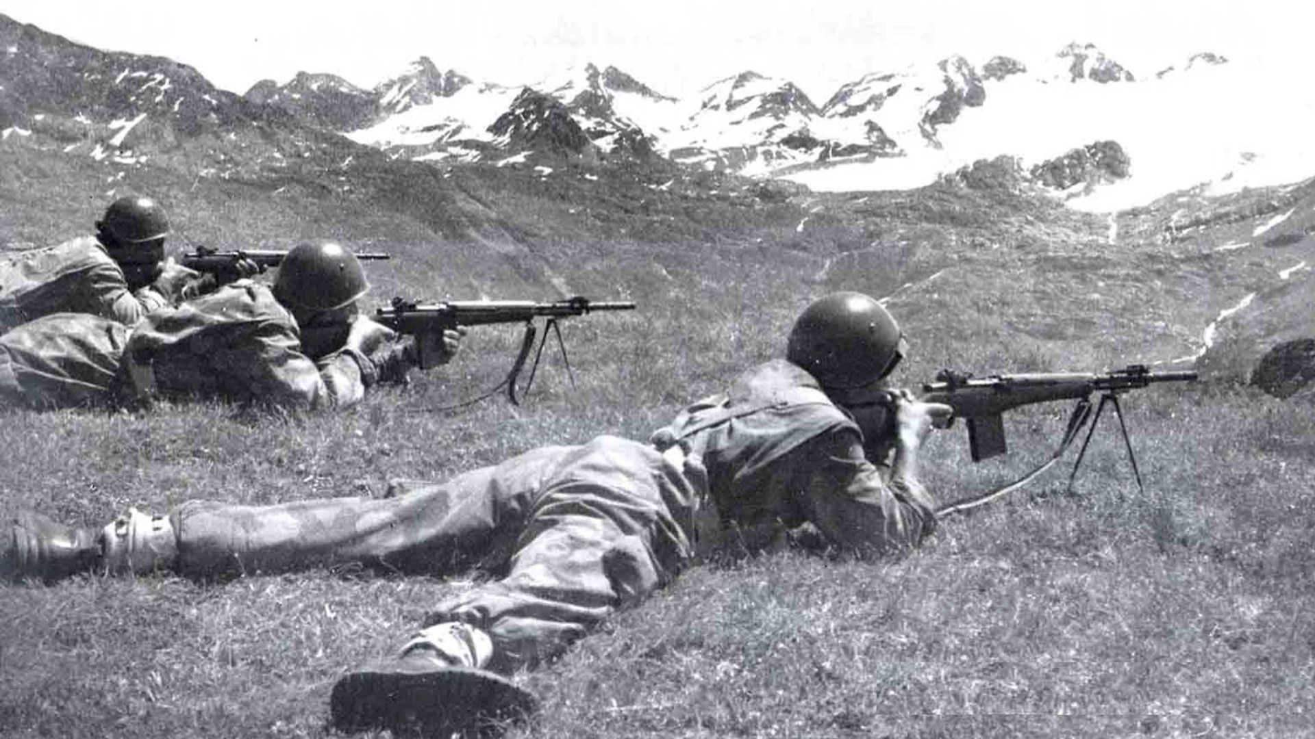 Italian troops firing their BM-59 Alpini rifles from their bipods.