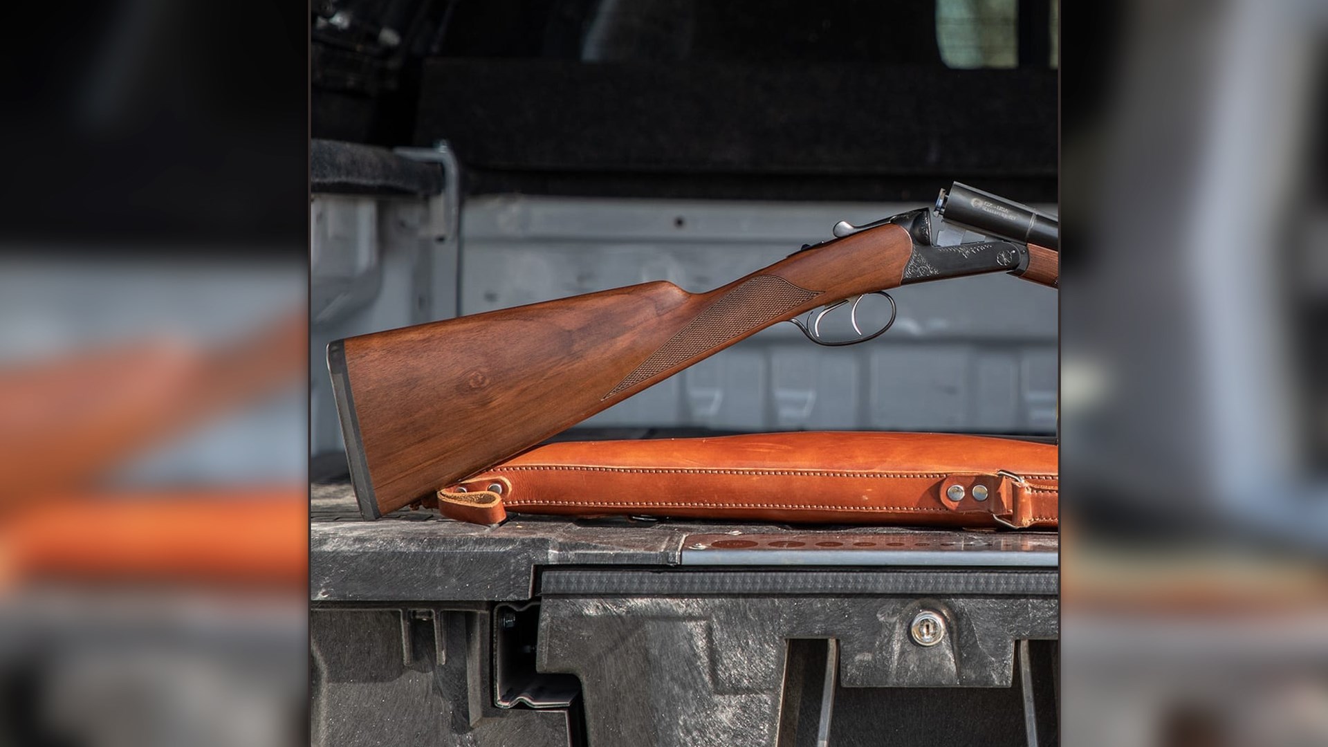 Image overlay square center blur background focus on cz bobwhite shotgun stock wood leather case black box truck bed