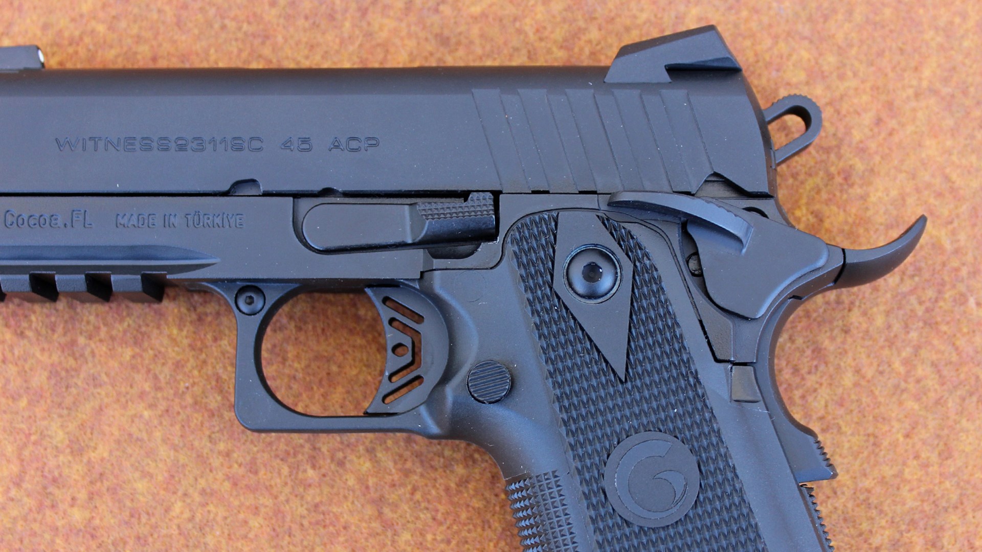 EAA Brat Witness2311SC 45 acp stamping on slide of black pistol handgun left-side view of controls trigger magazine release takedown lever safety sight hammer Picatinny rail