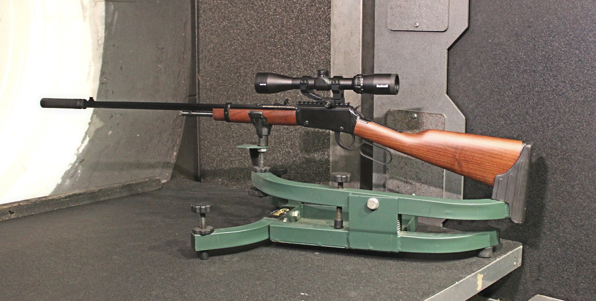 Henry H001 lever-action rimfire rifle onshoting bench indoor range cradle wood stock bushnell riflescope