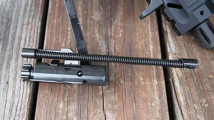 The MPX’s piston-driven bolt group’s adaptation from the SIG MCX Virtus rifle is evident. The recoil springs above the bolt group eliminates the need for buffer tube spring.