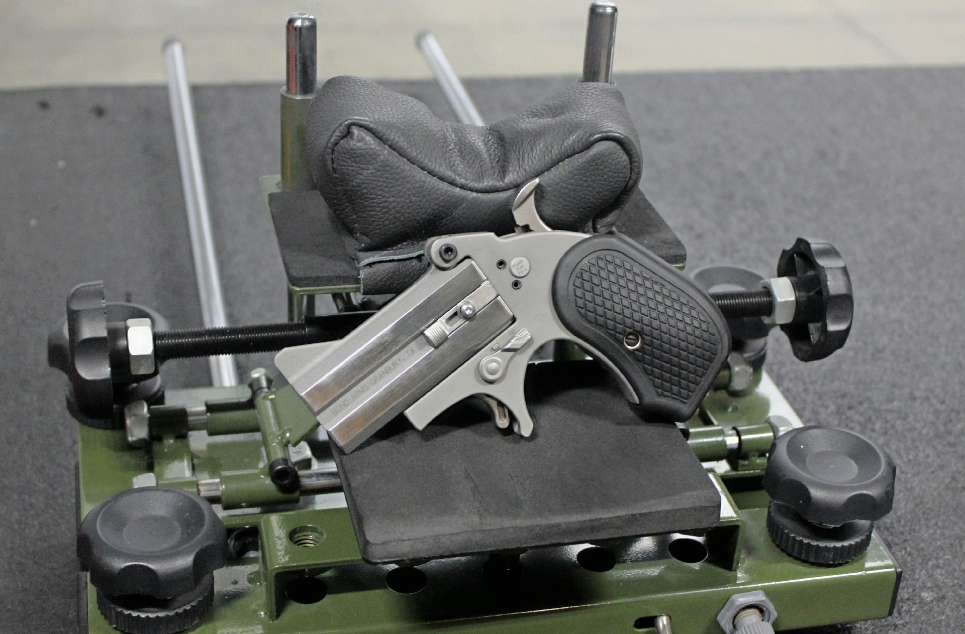 Left-side view of bond arms stinger rs conversion on shooting bench and support rest cradle