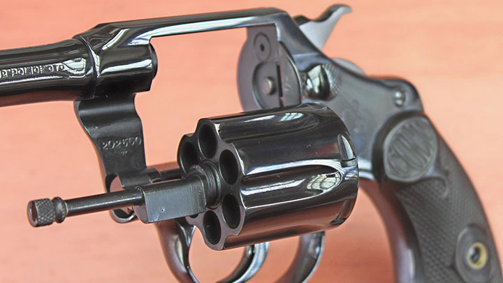 A close up of the refinished Colt Police Positive revolver with the cylinder opened.