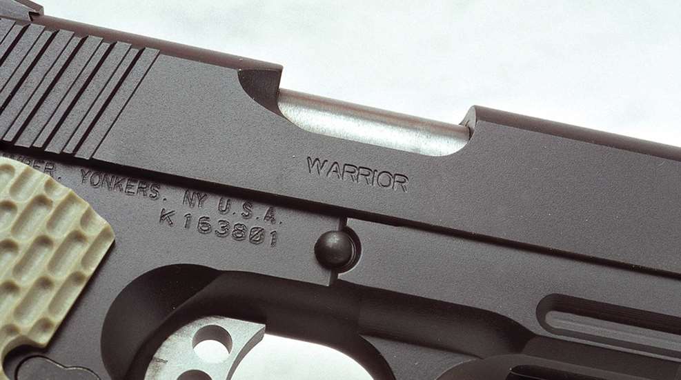 Kimber America Warrior M1911 semi-automatic pistol gun firearm closeup stamping barrel