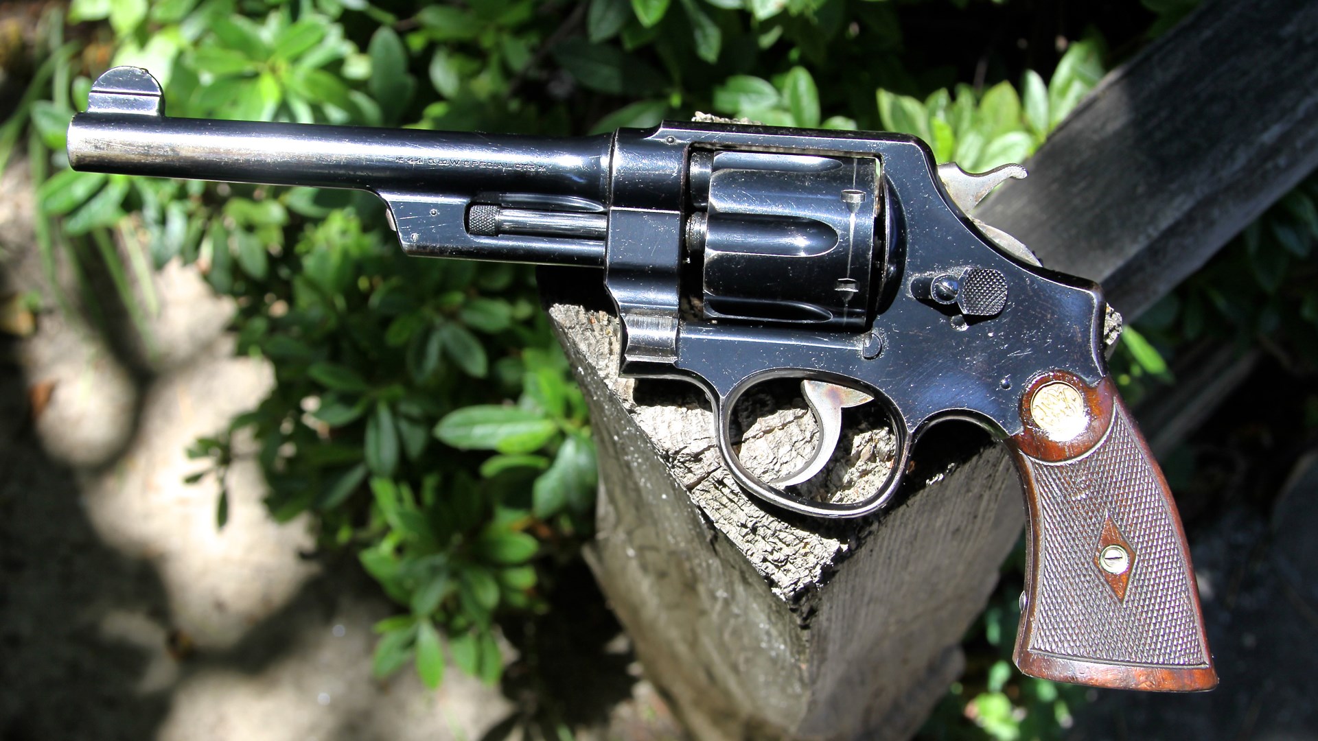 Smith & Wesson triple lock revolver outdoors left-side view The Smith & Wesson Triple Lock is thought by many to be the epitome of what a modern double-action should look like – even though it first came out in 1908 and started the S&W .44 Hand Ejector trilogy, which lasted until World War II. This particular Triple Lock was one of the last produced and was shipped to businessman J.F. Darling on Sept. 11, 1915.