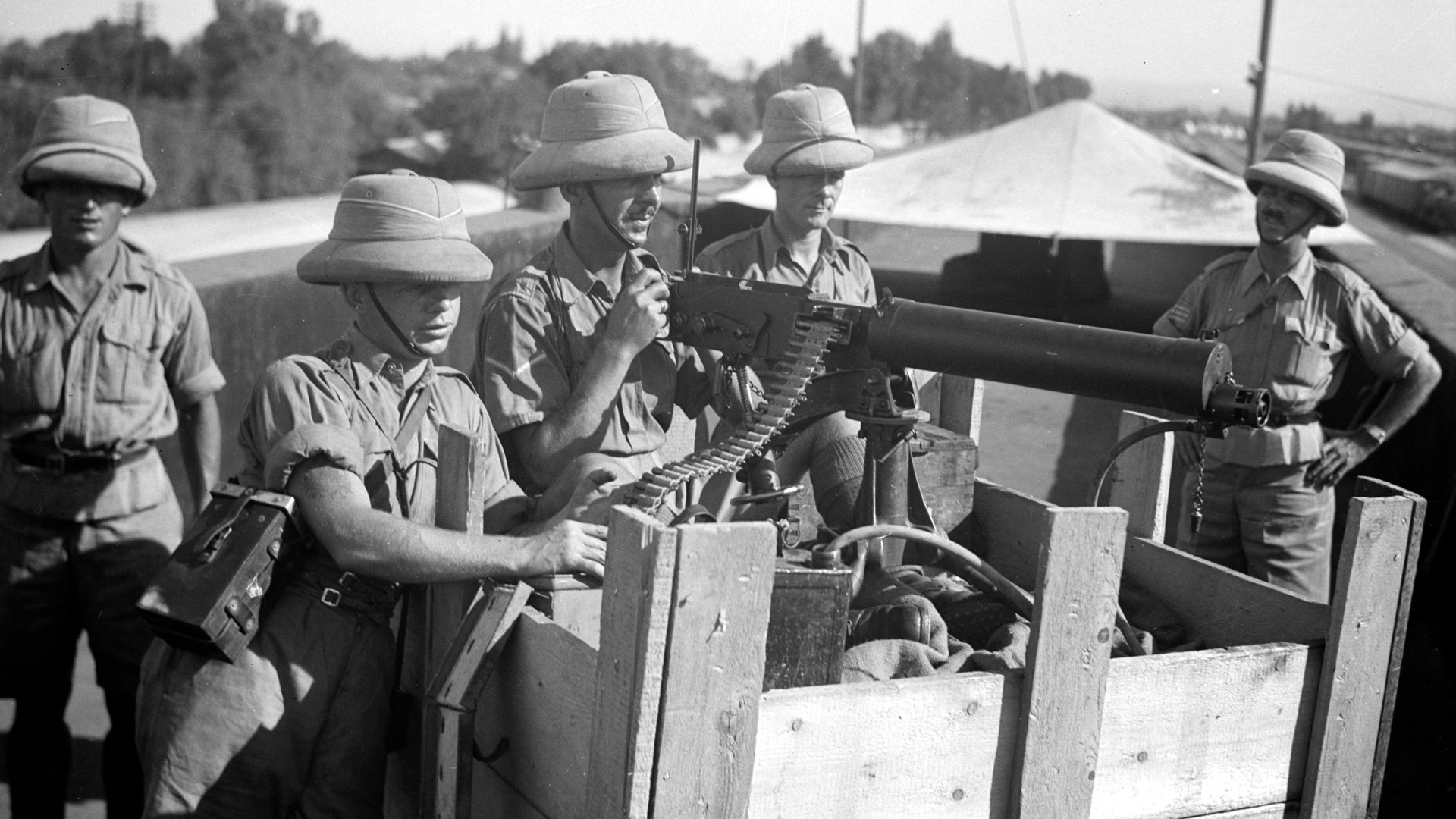 The Vickers machine gun was one of the dominant infantry weapons of the two World Wars.  This example covers a railroad station in Palestine—the smooth water jacket indicates this was one of the Vickers MGs made at Crayford in early 1937.  Library of Congress