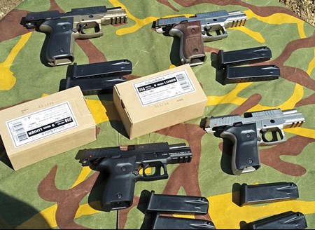 arrangement of handguns pistols camo tablecloth