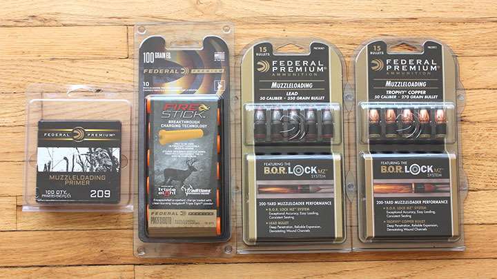 packages muzzleloader bullets powder primers on wood