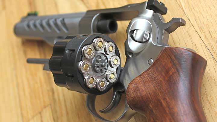 The cylinder opened on the Ruger GP100 with the moon clip attached to the 9 mm cartridges.