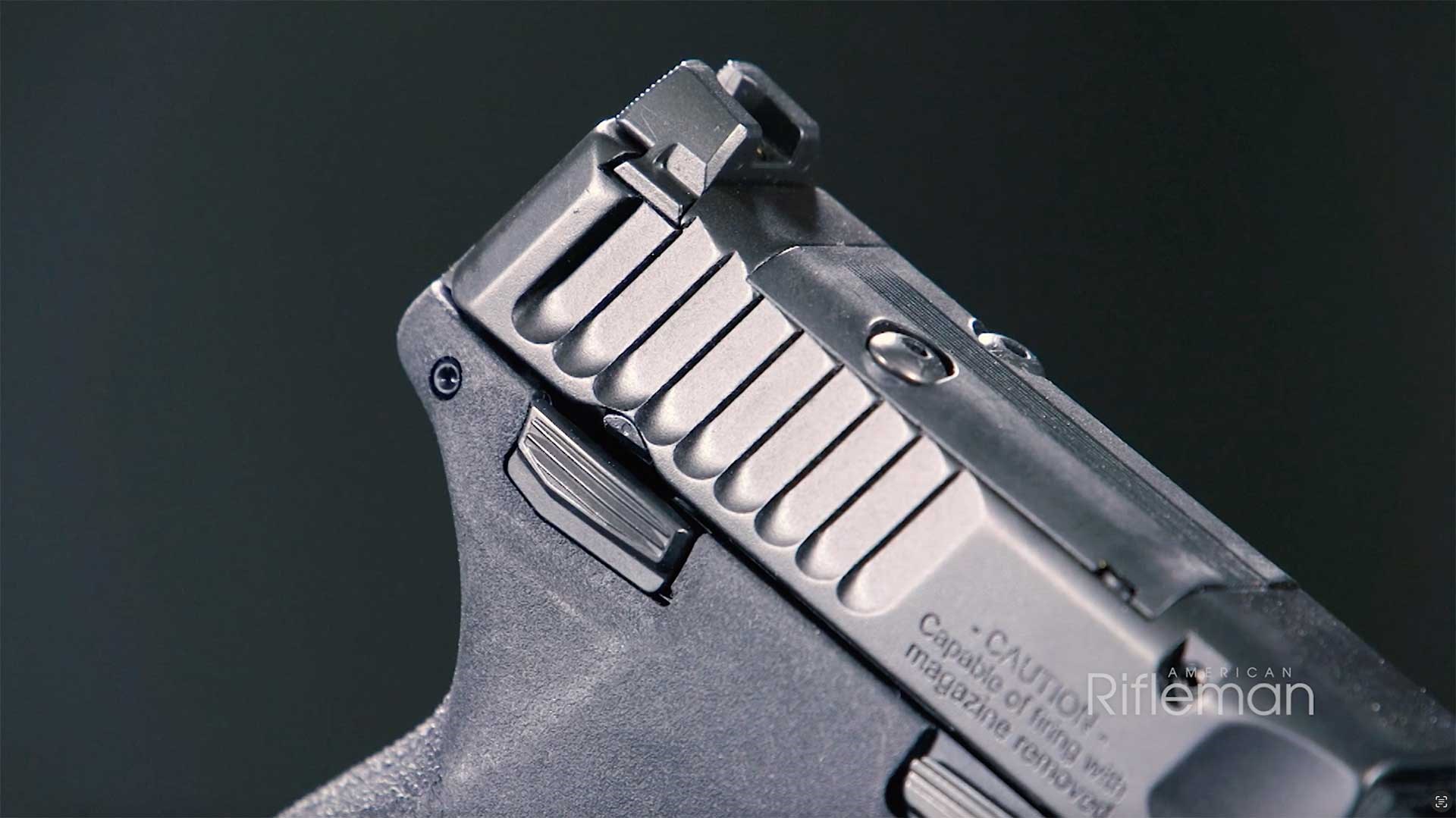 Optic mounting point, rear sight and manual safety lever at the rear of the Smith & Wesson M&P 22 Magnum.
