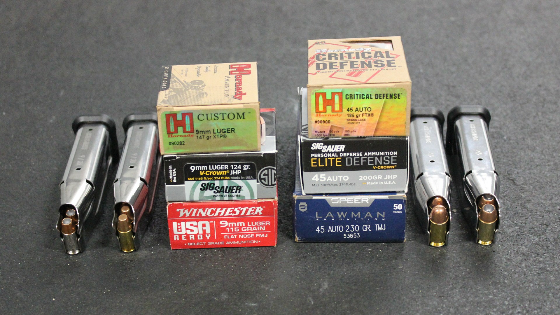 Ammunition boxes shown with EAA Brat handgun magazines fully loaded 9 mm .45 ACP