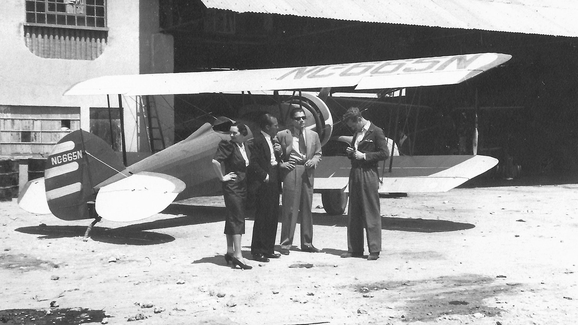 (Coates with biplane) Donald Coates’ tale about his film experience with Errol Flynn and Ernest Hemingway may have had something to do with his negotiations to acquire a two-seater observation biplane in 1946 at a Los Angeles-area airfield.