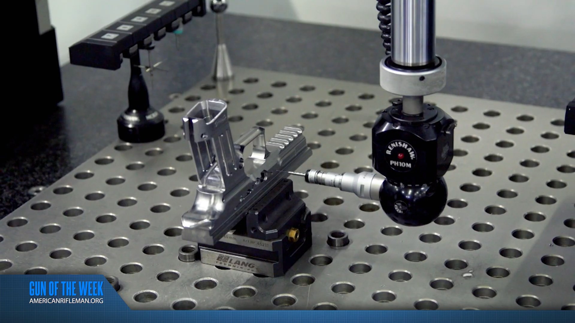 GUN OF THE WEEK AMERICANRIFLEMAN.ORG text banner overlay machine factory precision measuring aluminum frame