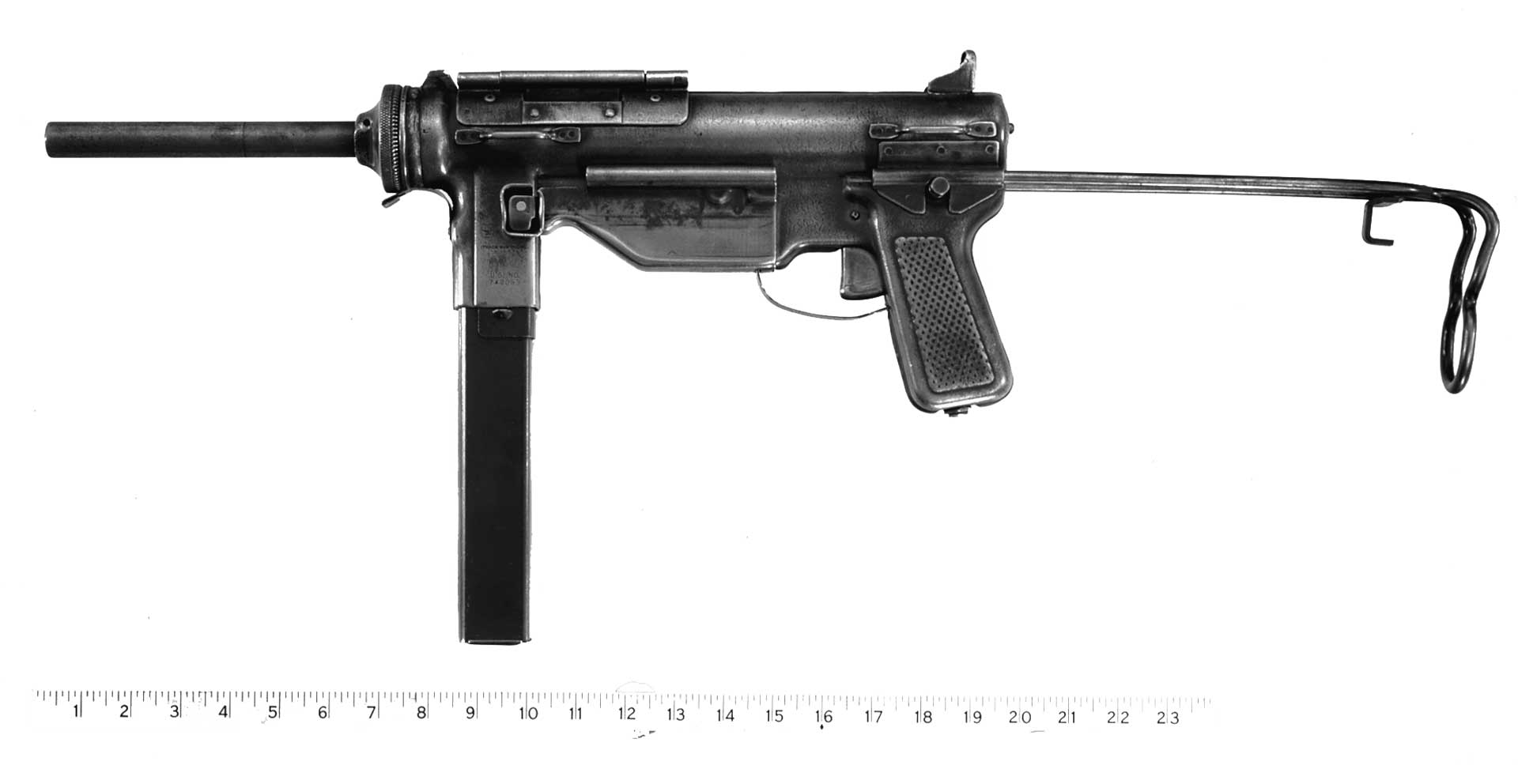 left side M3 grease gun submachine gun ruler metal