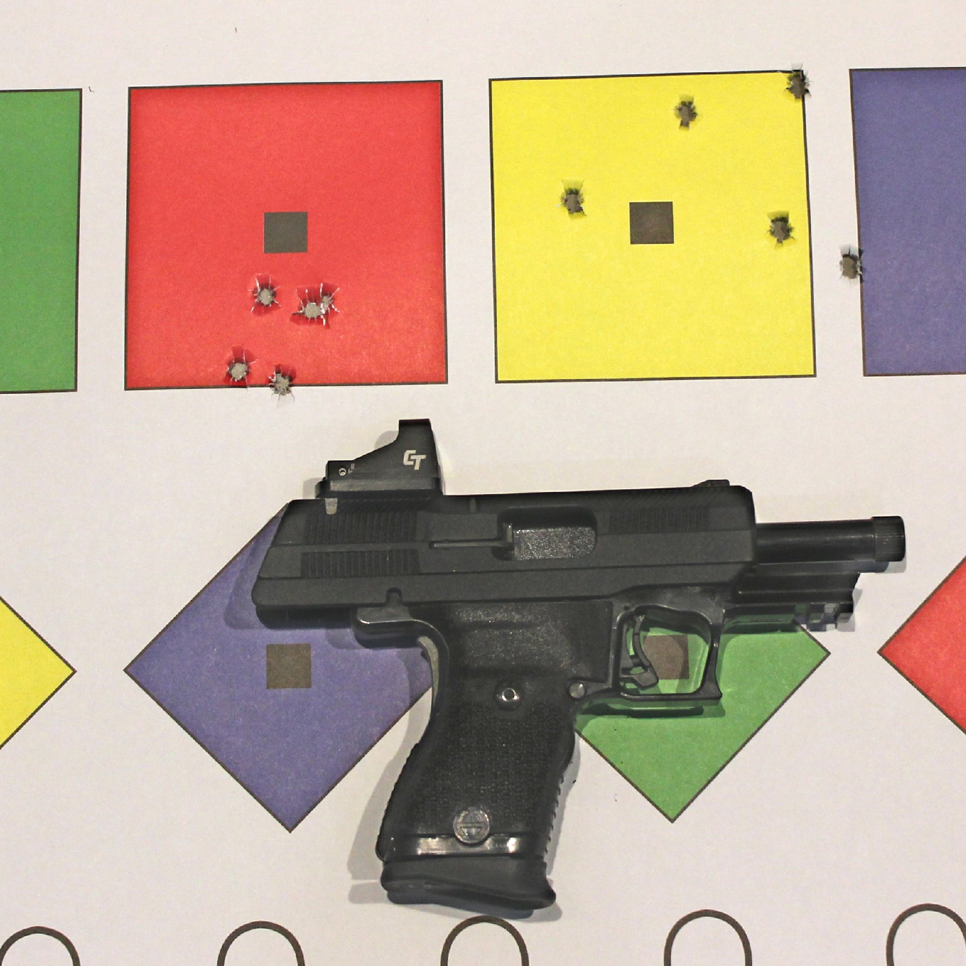 Hi-Point Firearms YC9RD right-side view with black slide locked back red-dot optic shownon paper target colored shapes accuracy shot group bullet clusters