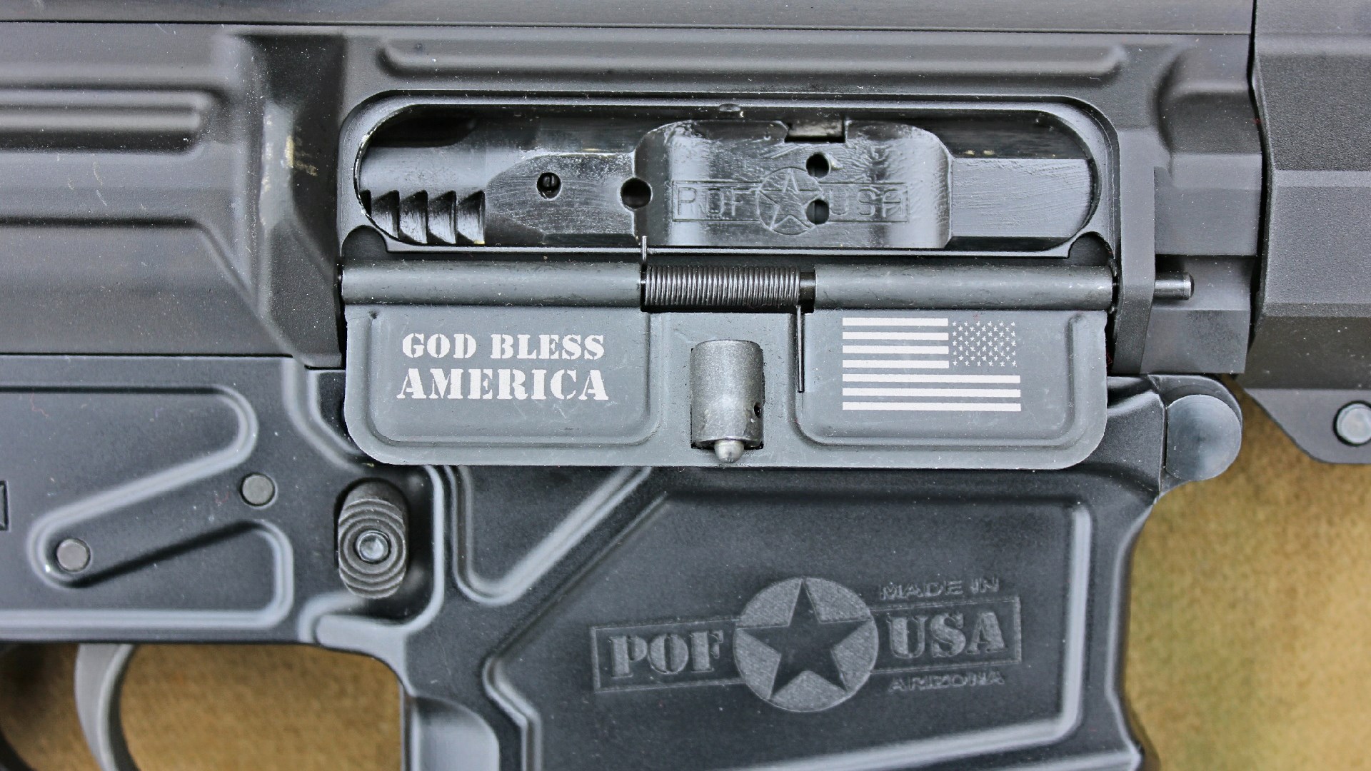 POF-USA LMR Base rifle receiver closeup right-side view of dustcover open with flag insignia logo and GOD BLESS AMERICA engraved