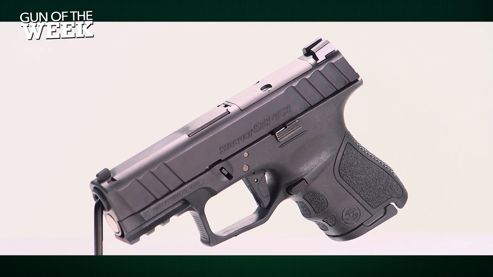 GUN OF THE WEEK text overlay Stoeger STR-9SC left-side view black pistol 9 mm white background
