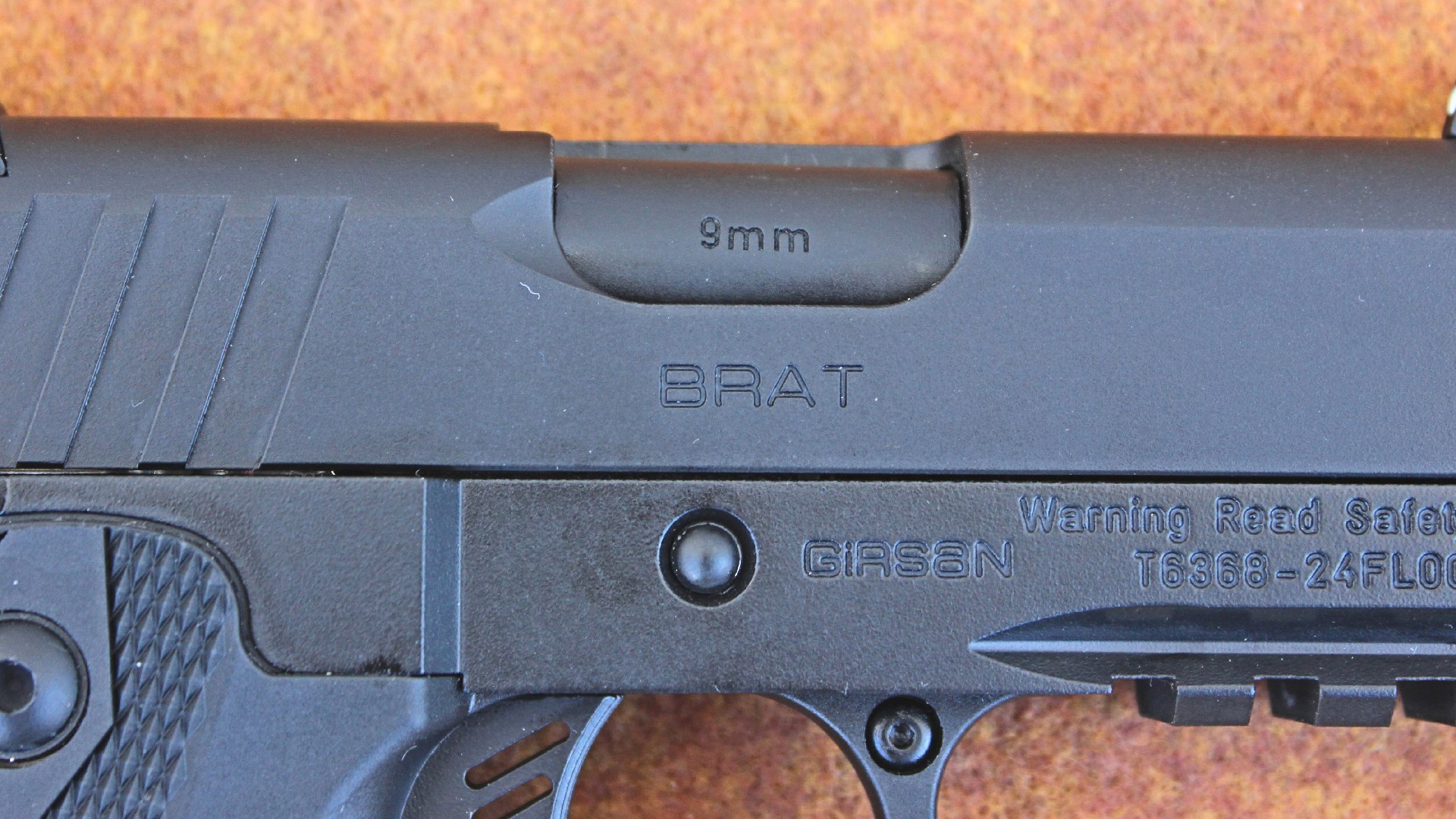 EAA BRAT rollmark on black pistol slide below ejection port
