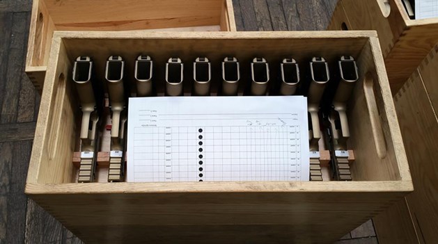 handguns pistol in wood box row lineup shipping display