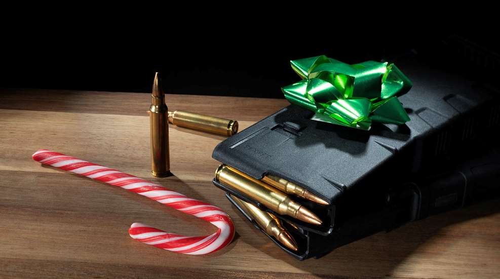 Holiday theme ammunition magazine gold bow candycane on table