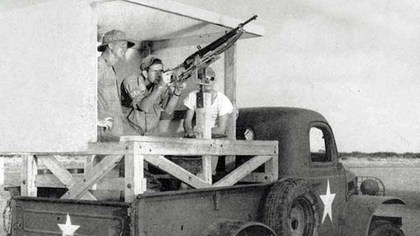 A Remington Model 11 set up on an aerial training mount in the bed of a truck. The truck would drive down a course as the trainee engaged targets.