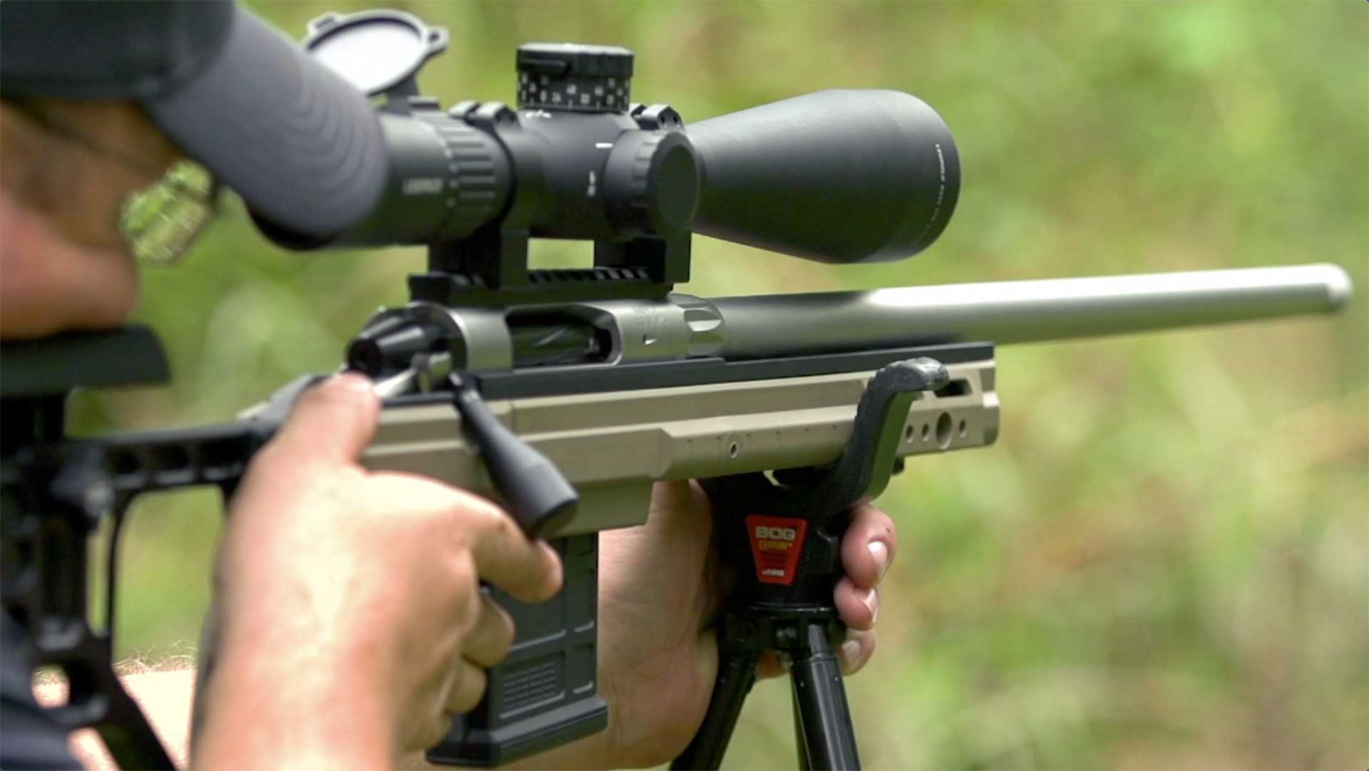 Shooting a Rock River Arms RGB-1S bolt-action rifle on an outdoor range.
