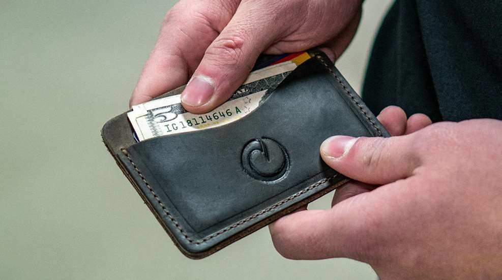 Origin Concealed Carry Wallet leather money in hands
