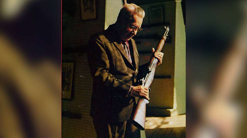 John C. Garand holding his famed rifle