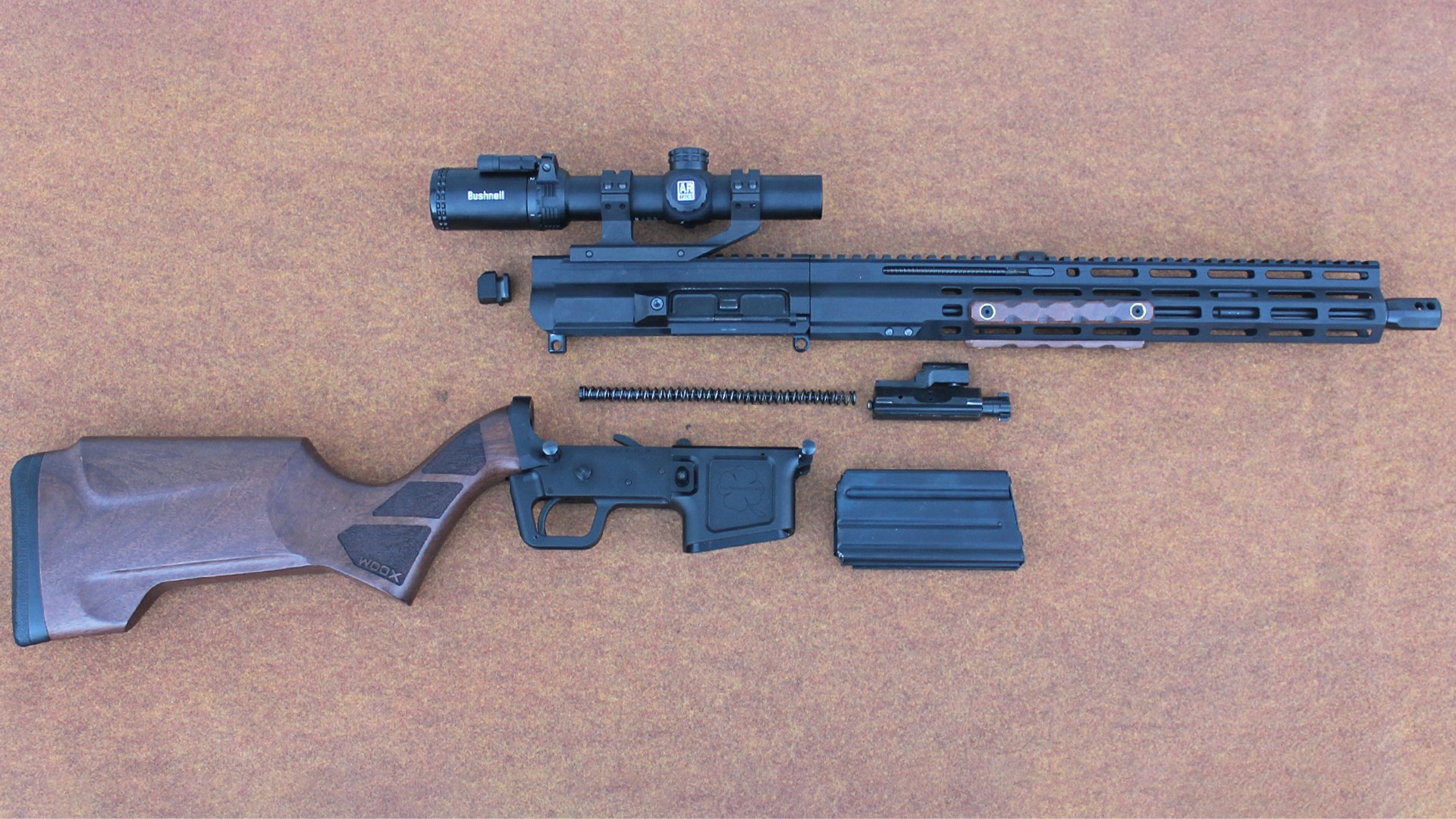 FM Products Rancher Rifle right-side exploded parts view shown separated receiver top bolt and carrier and spring middle and lower receiver, buttstock and magazine at bottom