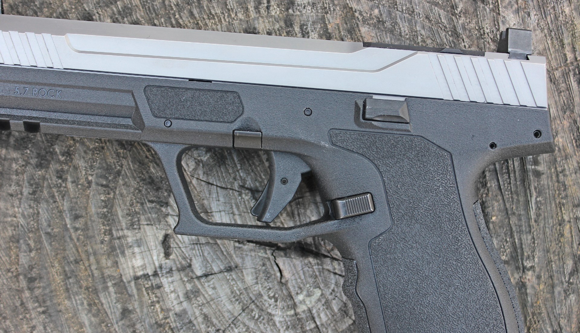 PSA Rock 5.7 pistol controls shown on log