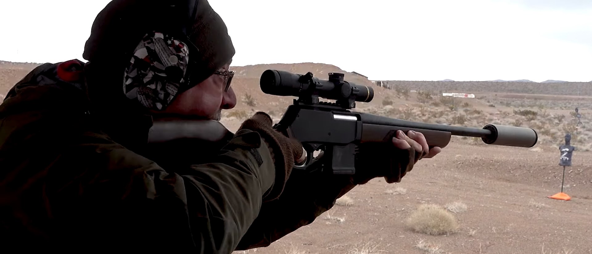 Man shooting the Henry Arms Lever Action Supreme Rifle.