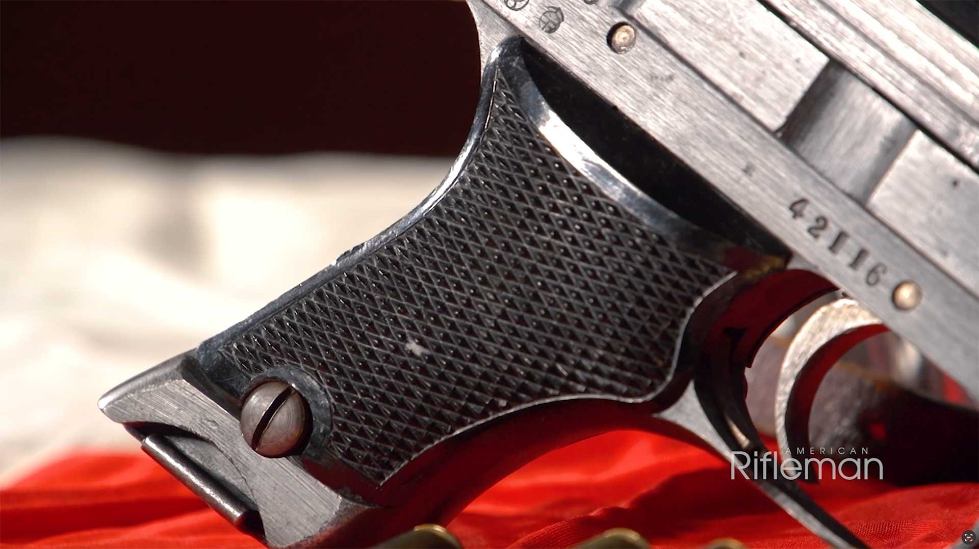 Japanese Type 94 pistol grip panel on the right side of the gun.