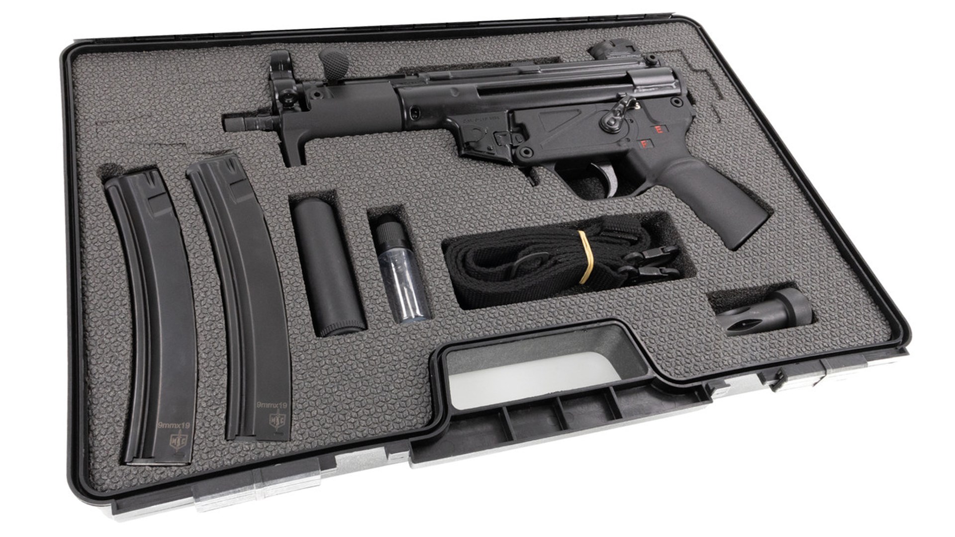 Military Armament Corp. MAC-5K black 9 mm pistol shown in custom-cut foam case with two magazines sling flashider tools