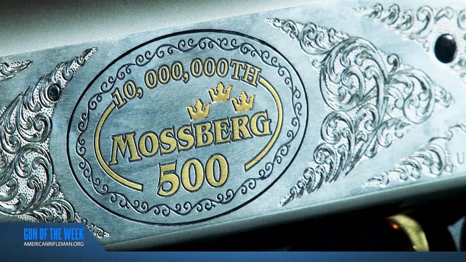10,000,000th Mossberg 500 shotgun receiver silver engraved closeup