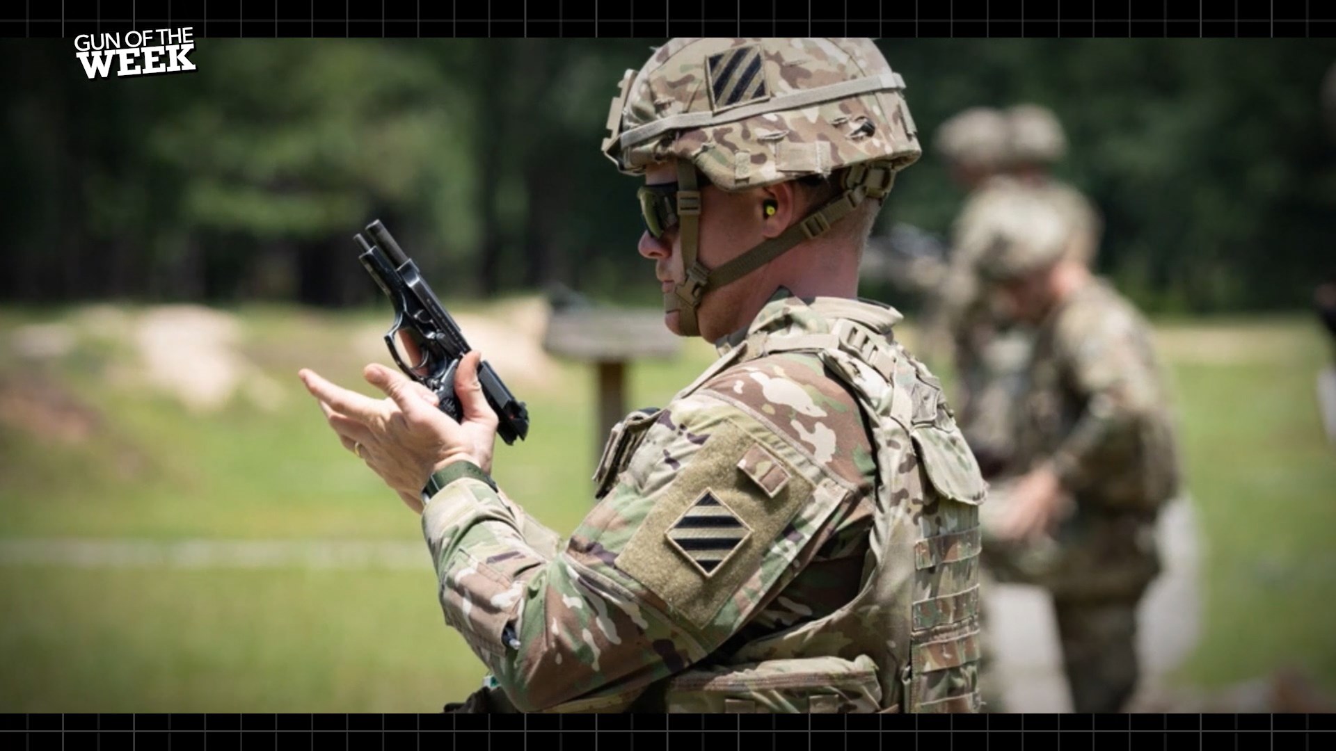 Soldier in full gear camo helmet gun testing handgun outdoors GUN OF THE WEEK text on image