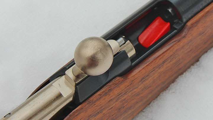 The bolt of the Mini Mosin opened, revealing the red spring-loaded EZ-Load feed ramp.